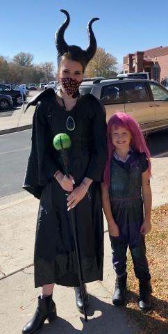 The picture is of a teacher and student dressed up for Halloween.  The teacher is dressed as Maleficent and the student  was Mal from the Descendants - Maleficent daughter.