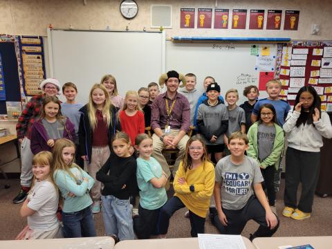 Pictured is a group of students in a classroom wear their Riverview Ram shirts. 