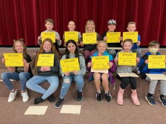 Pictured our fourth and fifth grade students holding up their yellow science certificate for winners moving on to the Nebo school district science fair
